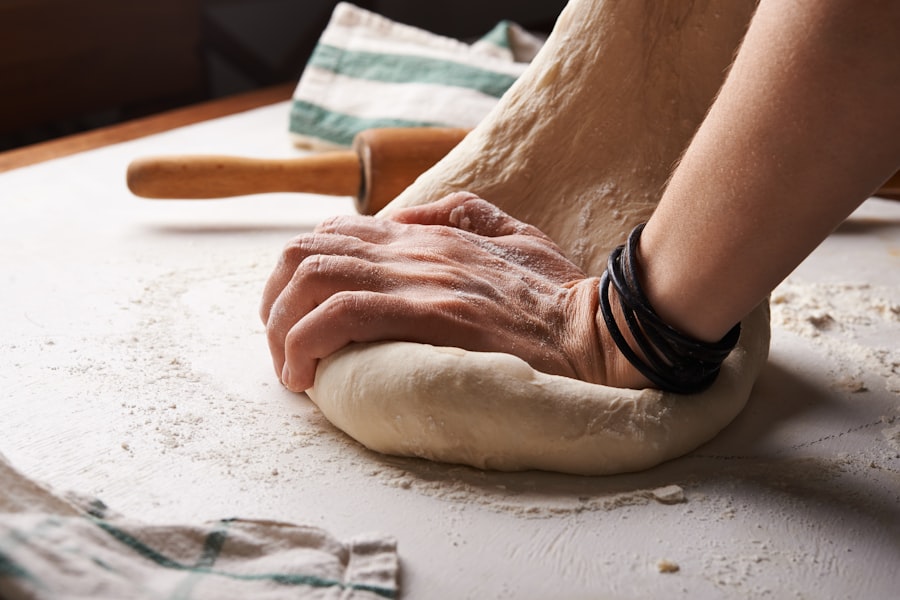 Hands shaping dough